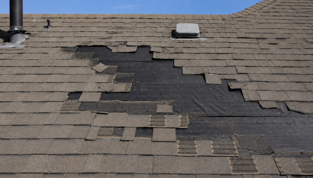 Shingle roof after a windstorm Conroe Tx